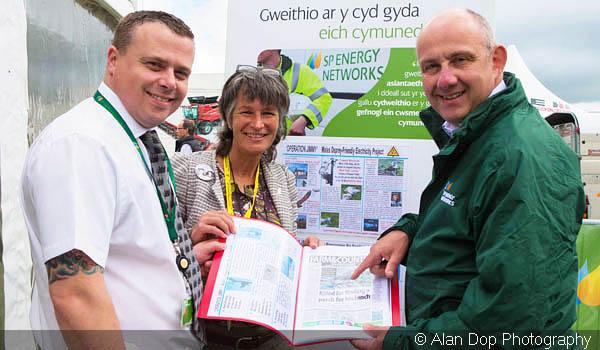 Gail with 2x Scottish Power Managers infront of 'Operation Jimmy' displays at The Anglesey Show 2015